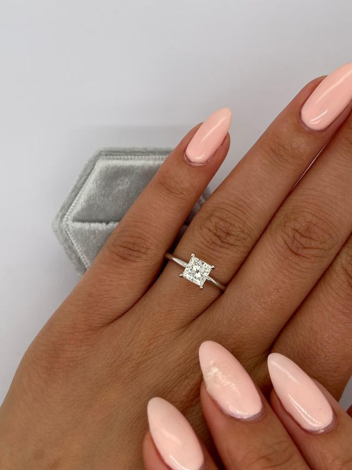 Princess cut lab grown diamond solitaire ring on a thin plain band
