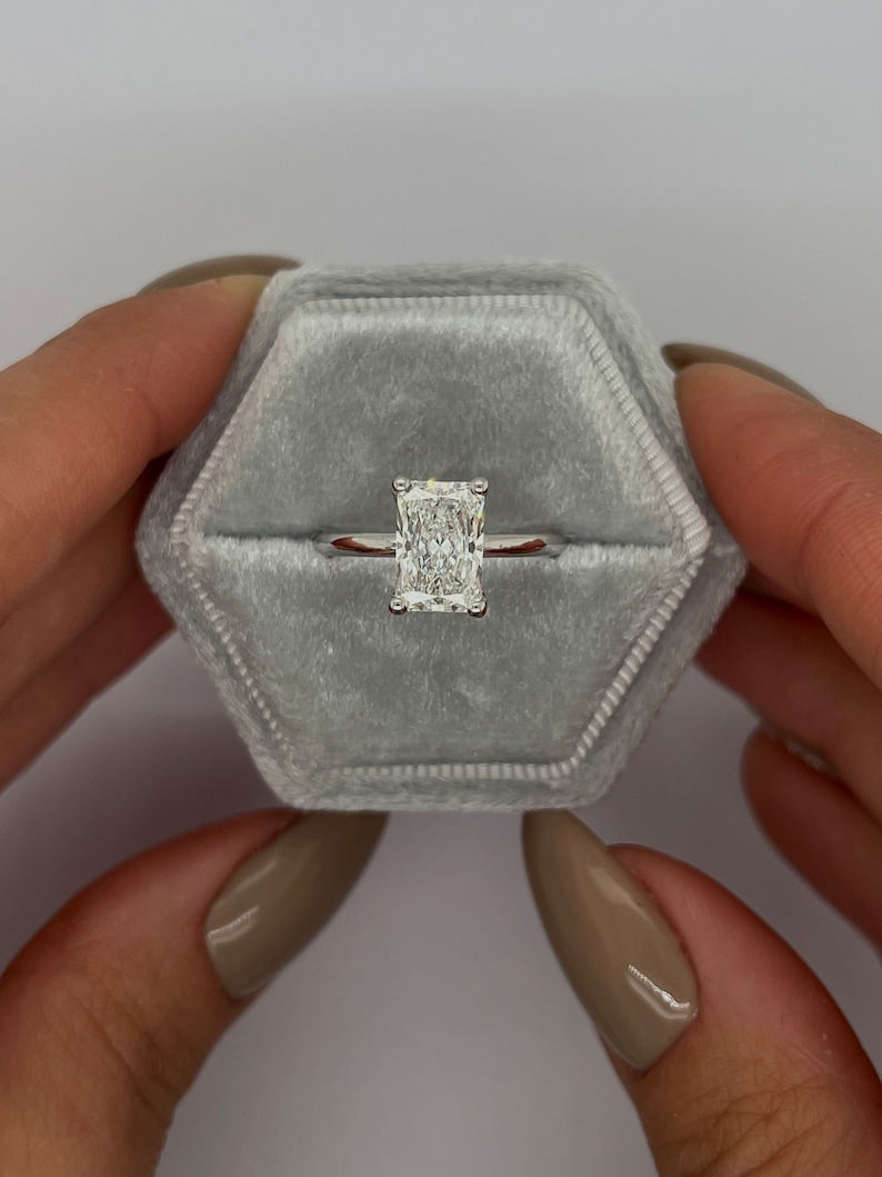 Radiant cut lab grown diamond solitaire ring in white metal on a thin plain band