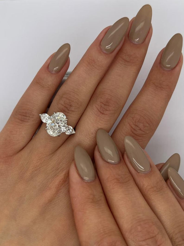 Top view of the oval centre diamond flanked by two pear cut diamonds