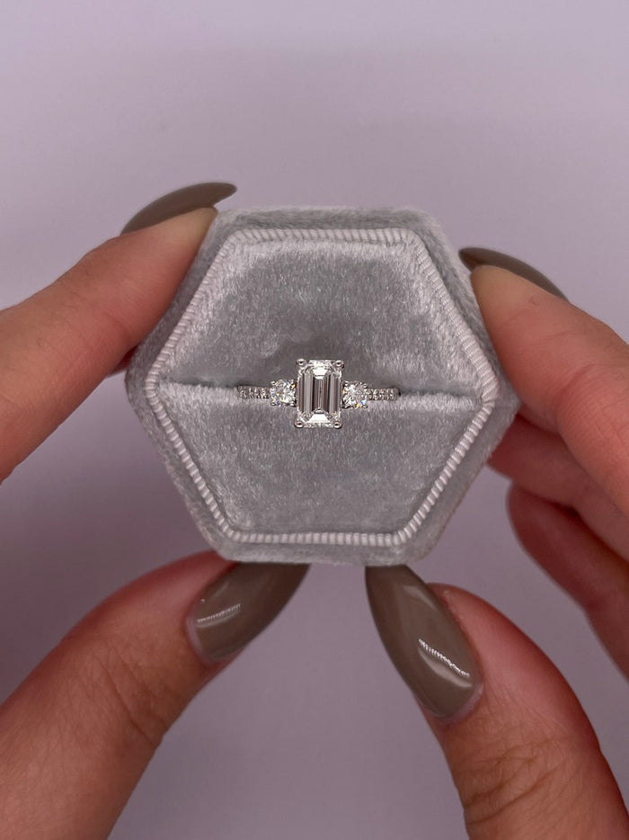 Top view of the emerald cut centre between two round brilliant side diamonds