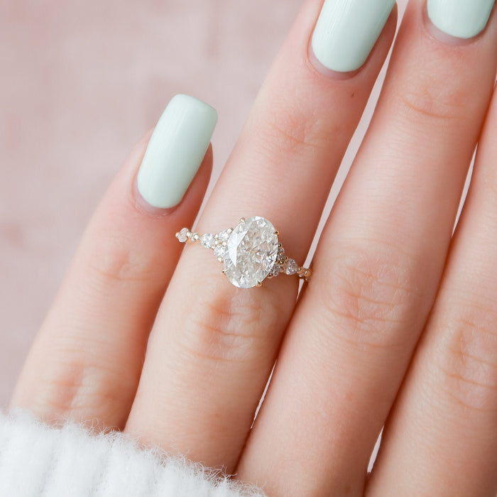 Oval moissanite cluster ring, front view
