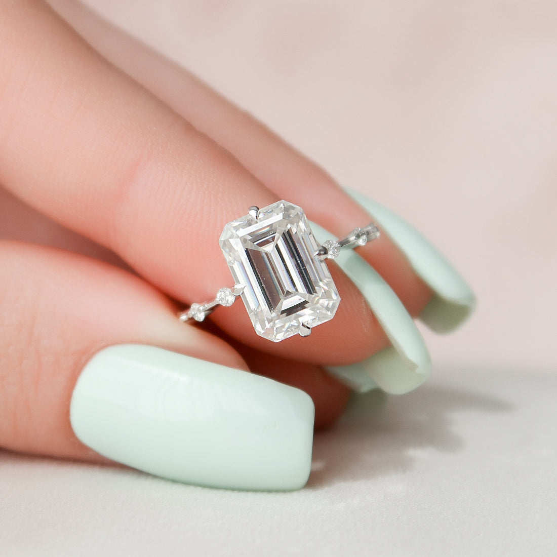 Emerald Cut Moissanite Solitaire Engagement Ring with Accent Stone Band - front view 1
