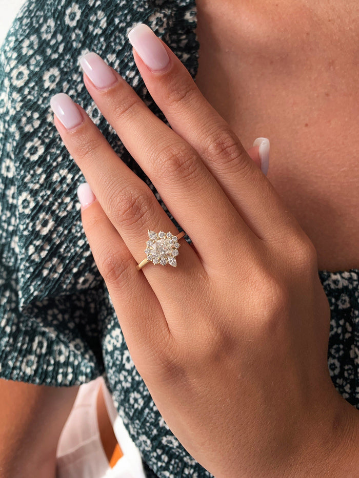 Oval cut lab grown diamond floral cluster engagement ring in yellow gold