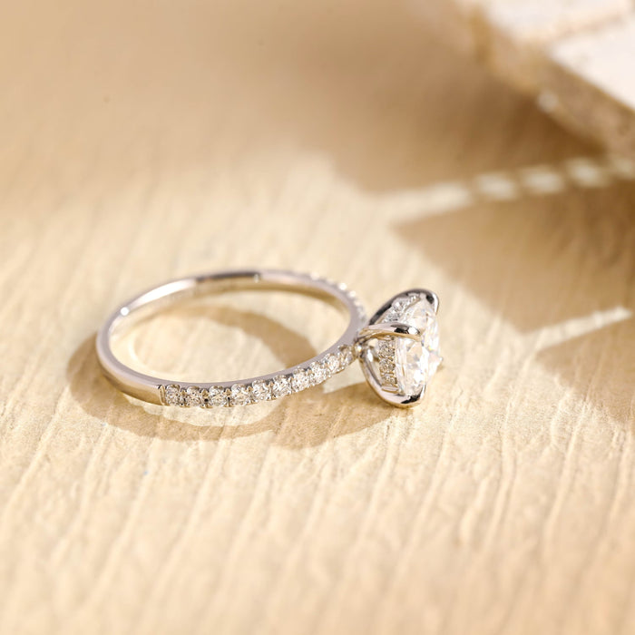 Square cushion moissanite hidden halo engagement ring in four claws on a slim white gold band micro pave set with tiny round stones, view 2