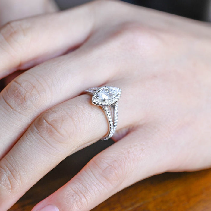 Marquise cut moissanite halo engagement ring with a pave set split shank band in white gold, view 2