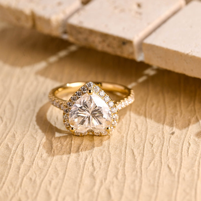 Heart cut moissanite classic halo engagement ring with a pave set yellow gold band