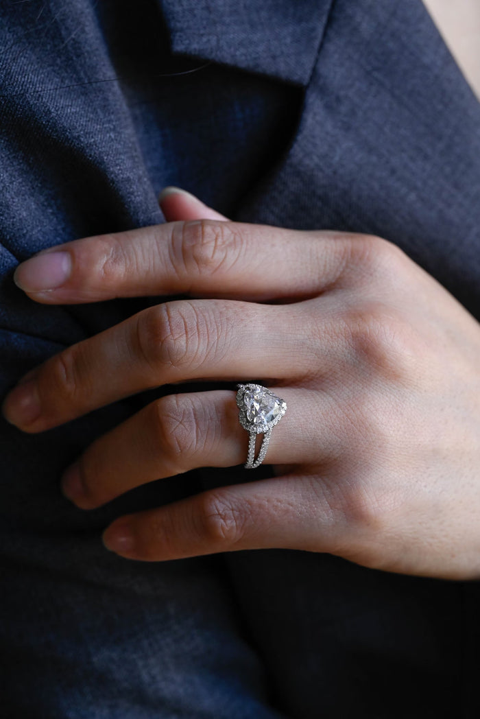Heart cut moissanite halo engagement ring with a split shank pave set white gold band, view 2