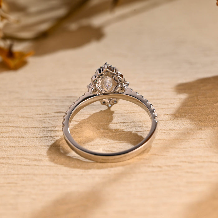 Marquise cut moissanite cluster halo engagement ring with four small marquise accent stones and a pave set white gold band, view 2