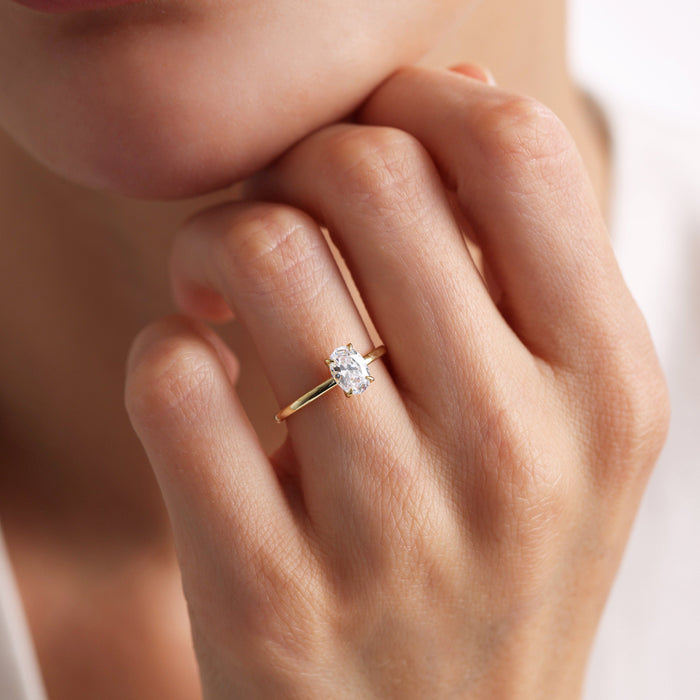 Delicate Oval Cut Moissanite Solitaire Engagement Ring with Fine Four Prong Setting - view 1