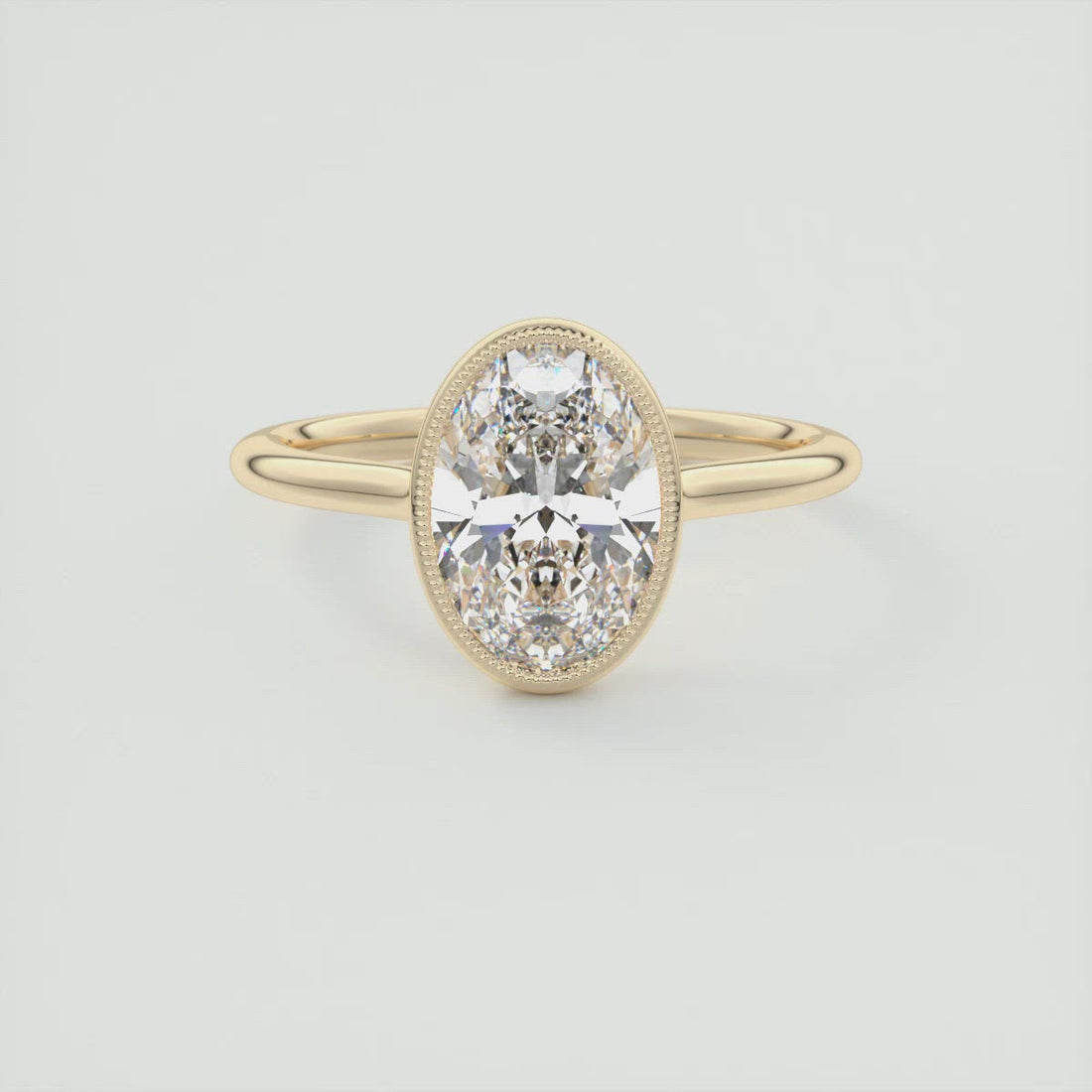 Oval cut moissanite milgrain bezel engagement ring in yellow gold