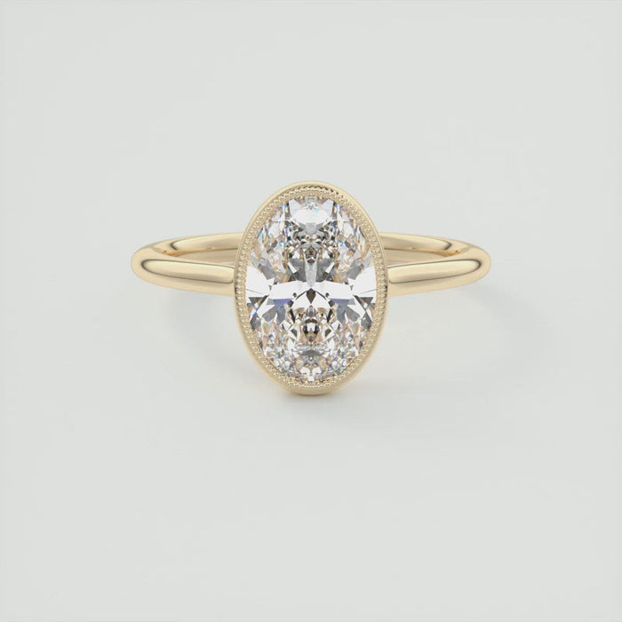 Oval cut moissanite milgrain bezel engagement ring in yellow gold