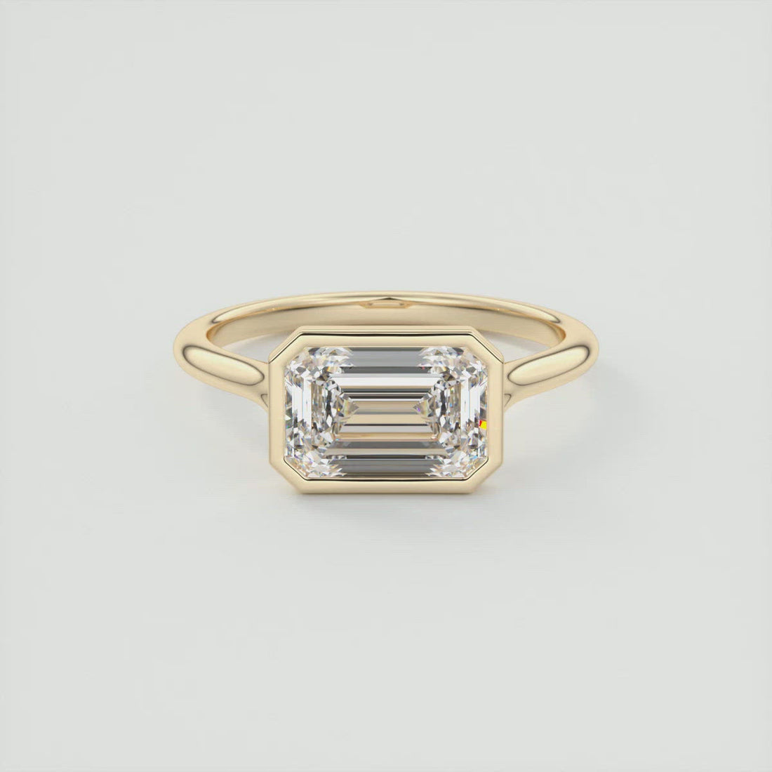 Emerald Cut Moissanite East West Full Bezel Engagement Ring - front view 1