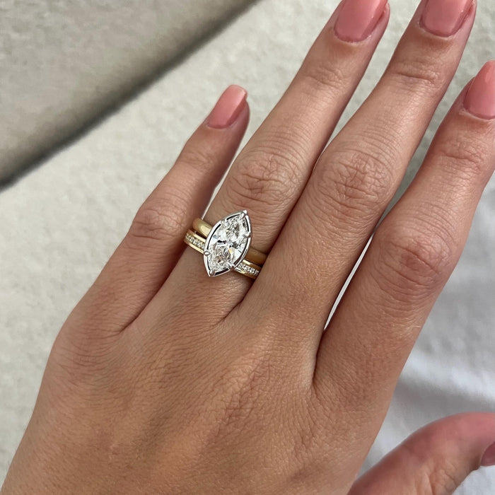 Marquise lab grown diamond bezel and prong bridal set on the hand