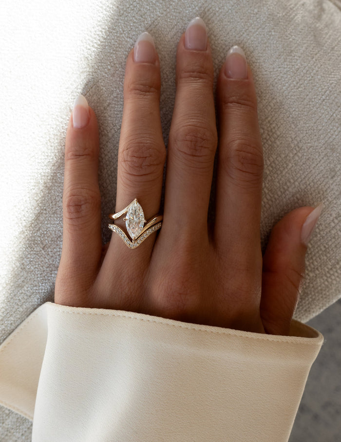 Marquise lab grown diamond bypass ring and pave chevron band in yellow gold shown on the full hand