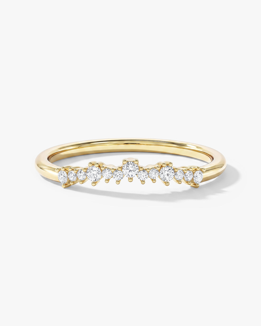 Dainty curved round moissanite wedding band in yellow gold