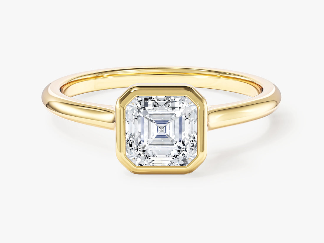 Dainty Asscher moissanite bezel engagement ring in yellow gold, front view