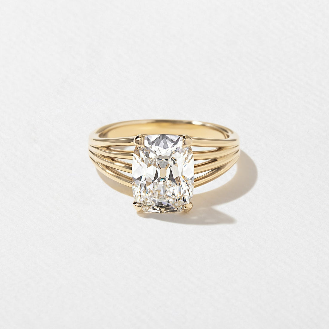 Antique cushion cut moissanite four rail split shank engagement ring in yellow gold