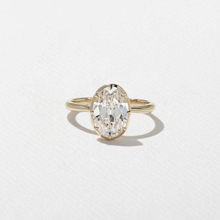 Antique oval cut moissanite solitaire engagement ring in yellow gold