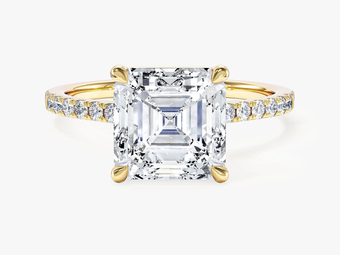 Large asscher cut moissanite statement engagement ring with pave set band in 14K yellow gold, front view