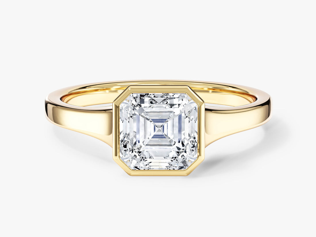 Asscher cut moissanite bezel solitaire engagement ring with tapered flat band in 14K yellow gold, front view