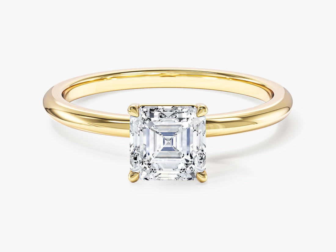 Asscher cut moissanite four claw solitaire engagement ring with thin plain band in yellow gold, front view