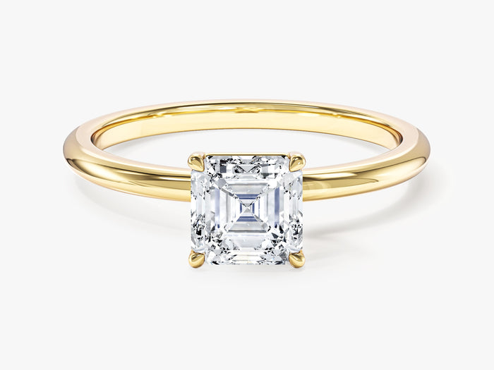 Asscher cut moissanite four claw solitaire engagement ring with thin plain band in yellow gold, front view