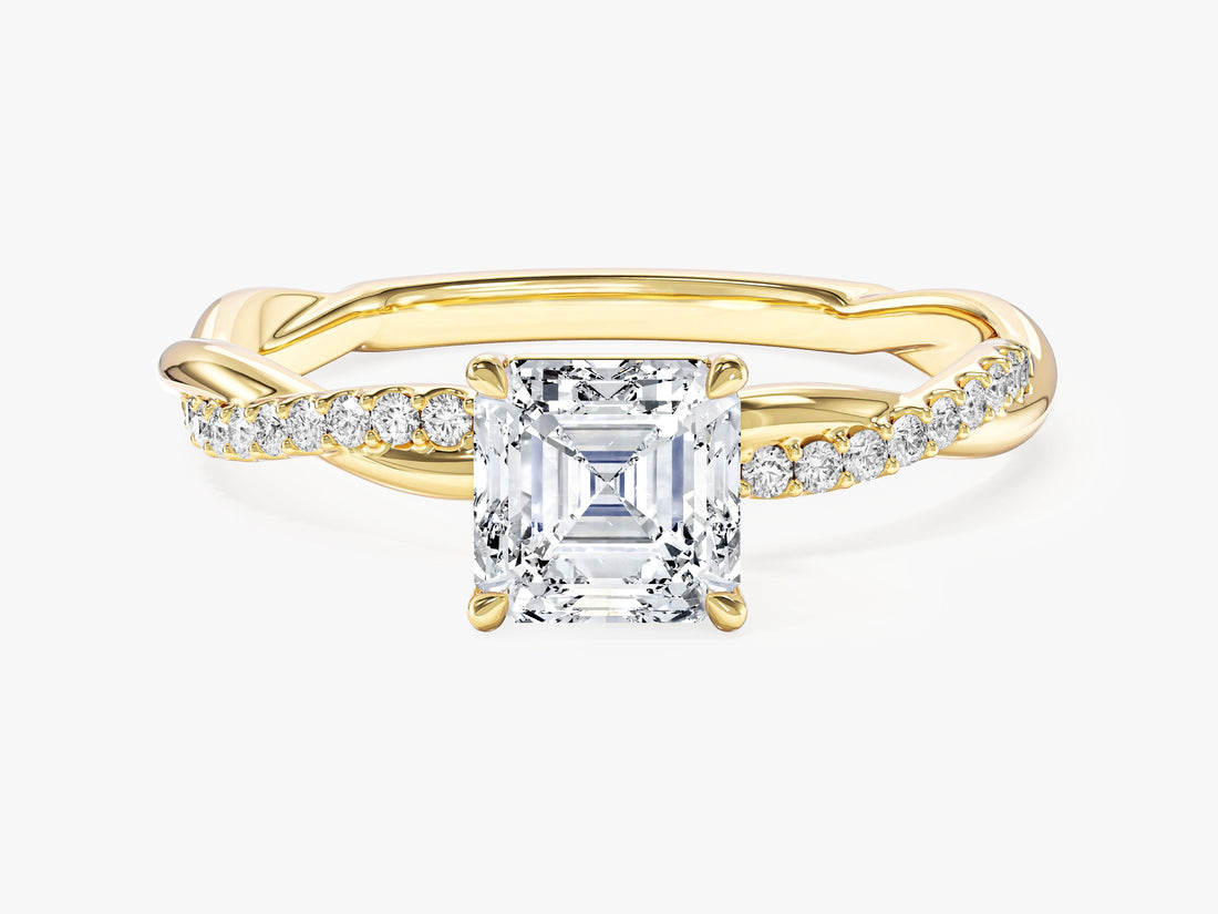 Dainty asscher moissanite twist band engagement ring with half pave crossover in yellow gold, front view