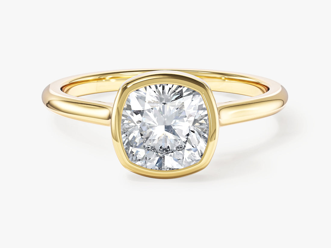 Bezel set cushion moissanite minimalist engagement ring in yellow gold, front view
