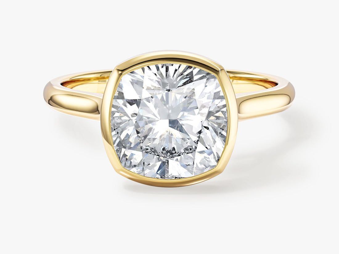 Large cushion moissanite bezel engagement ring in yellow gold, front view
