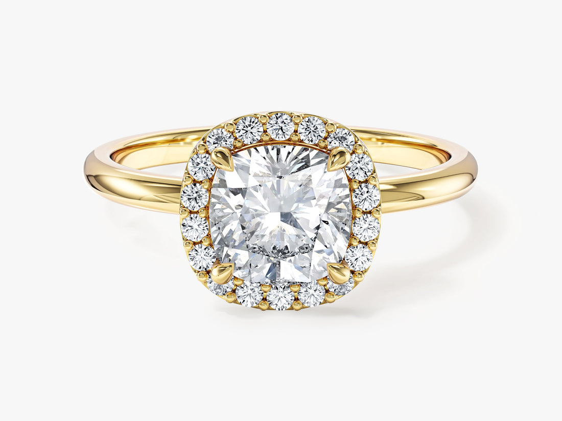 Cushion moissanite halo engagement ring on a polished solitaire band in yellow gold, front view