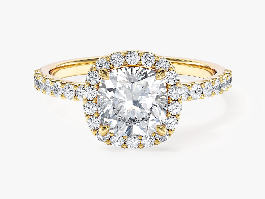 Square cushion moissanite halo engagement ring with pave shank in yellow gold, front view