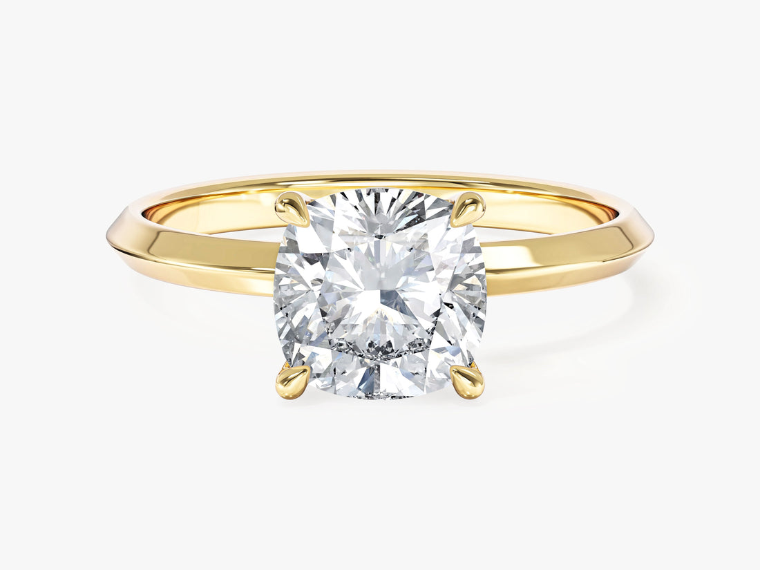 Cushion cut moissanite knife edge solitaire engagement ring in 14K yellow gold, front view