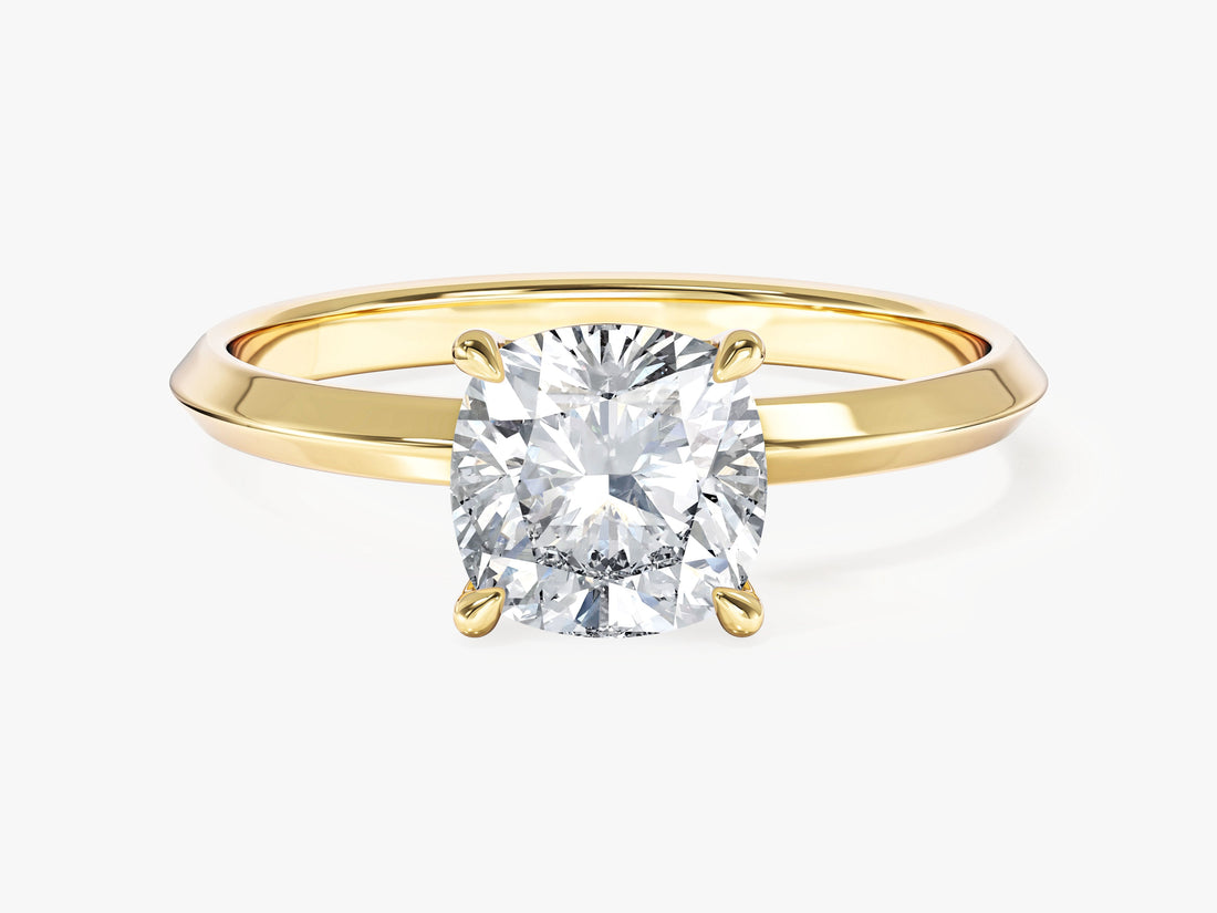 Square cushion moissanite four prong engagement ring on a knife edge band in 14K yellow gold