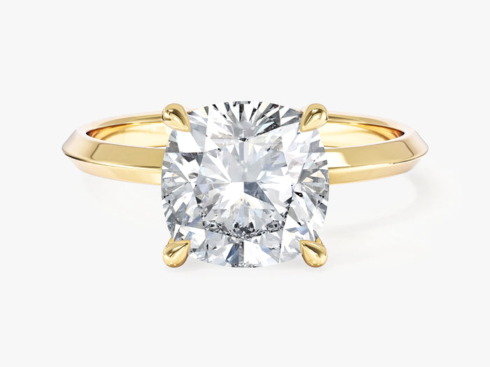 Large cushion cut lab grown diamond statement solitaire with knife edge band in yellow gold, front view