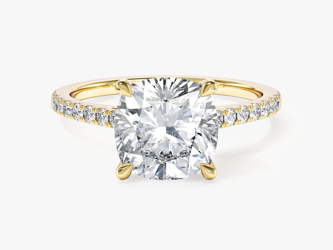 Large cushion cut moissanite engagement ring with scalloped pave band in yellow gold, front view