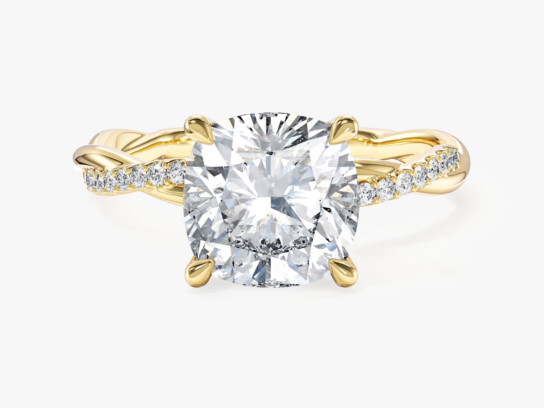 Large cushion cut moissanite engagement ring with braided pave twist band in 14K yellow gold, front view
