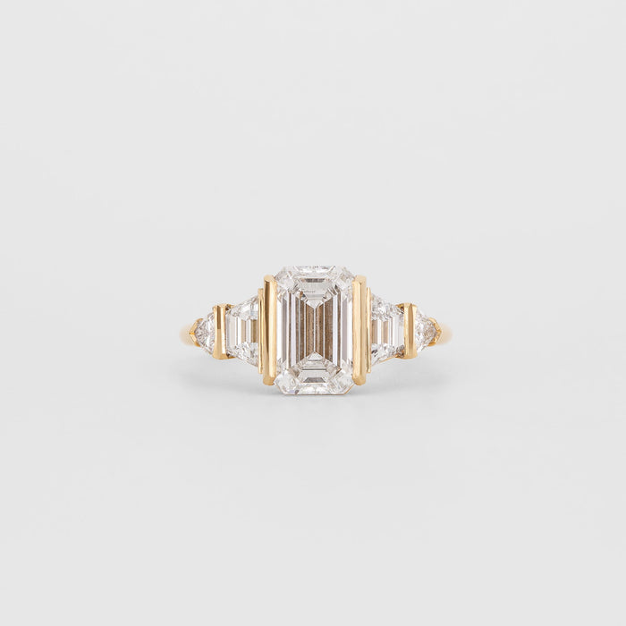 Emerald cut moissanite bar set five stone art deco engagement ring in yellow gold