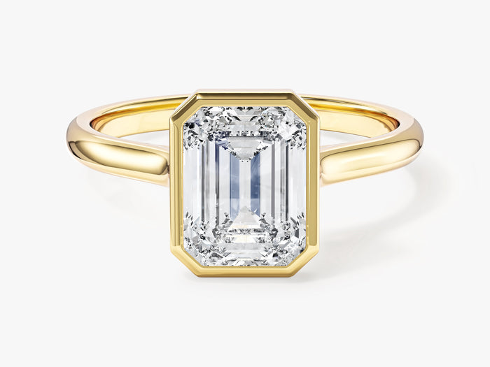 Emerald cut lab grown diamond bezel solitaire engagement ring in yellow gold, front view