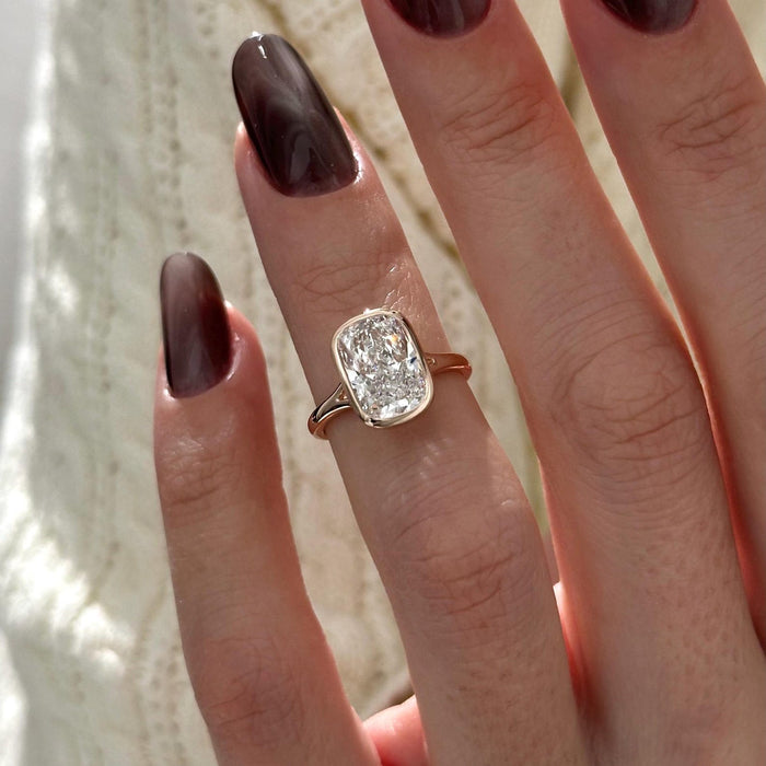 Elongated cushion moissanite bezel split shank engagement ring in rose gold