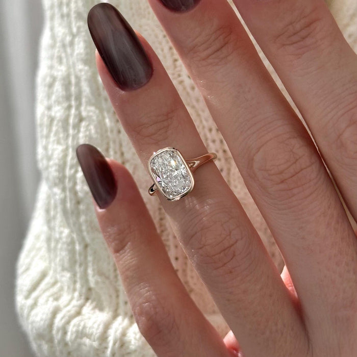 Elongated cushion moissanite bezel split shank engagement ring in rose gold, view 2