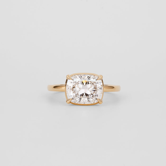 East west elongated cushion moissanite solitaire engagement ring in yellow gold, view 2