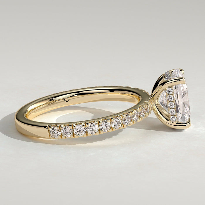 Elongated cushion moissanite engagement ring on a full pave eternity band in yellow gold, view 2