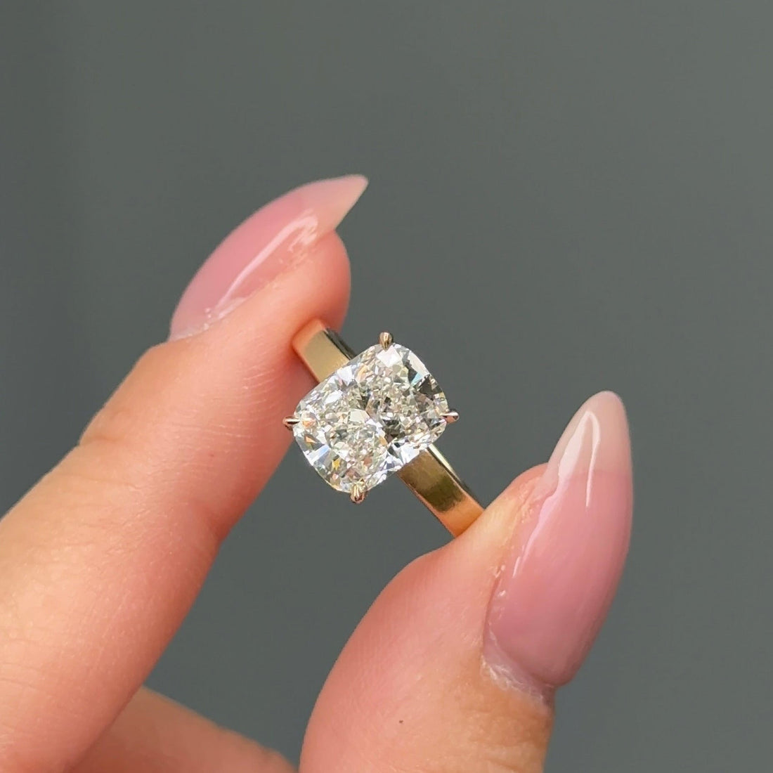 Elongated cushion moissanite flat band solitaire engagement ring in yellow gold
