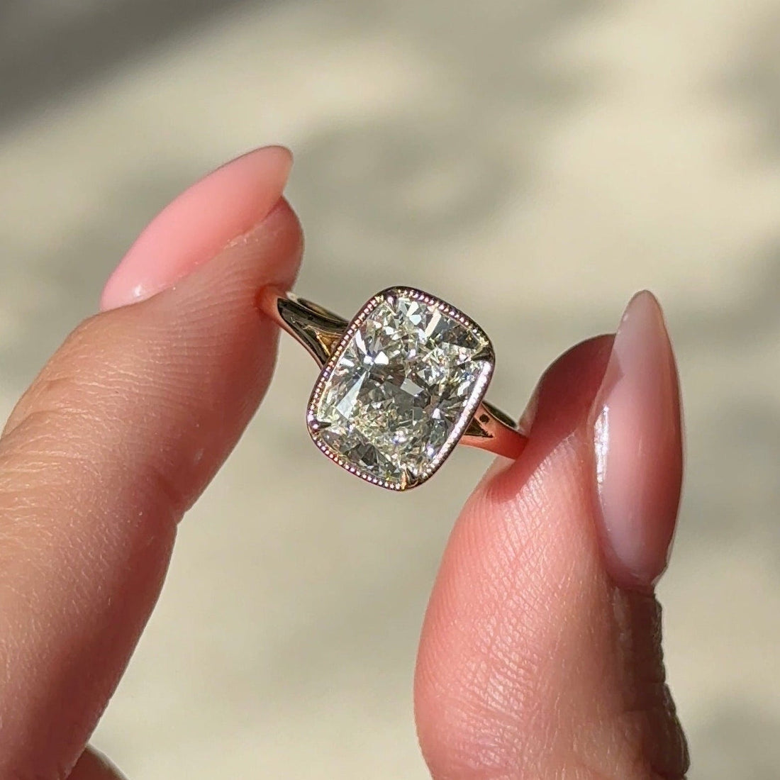 Elongated cushion moissanite milgrain bezel engagement ring in rose gold