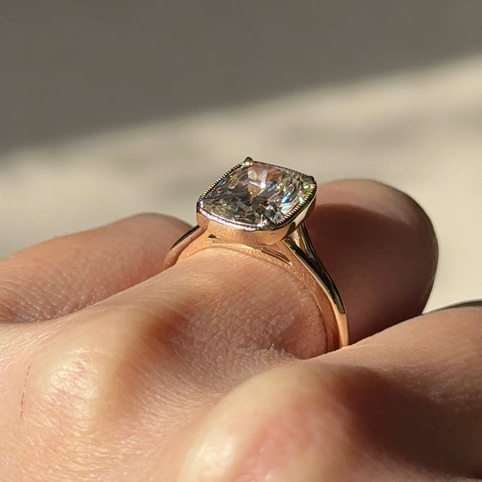 Elongated cushion moissanite milgrain bezel engagement ring in rose gold, view 2