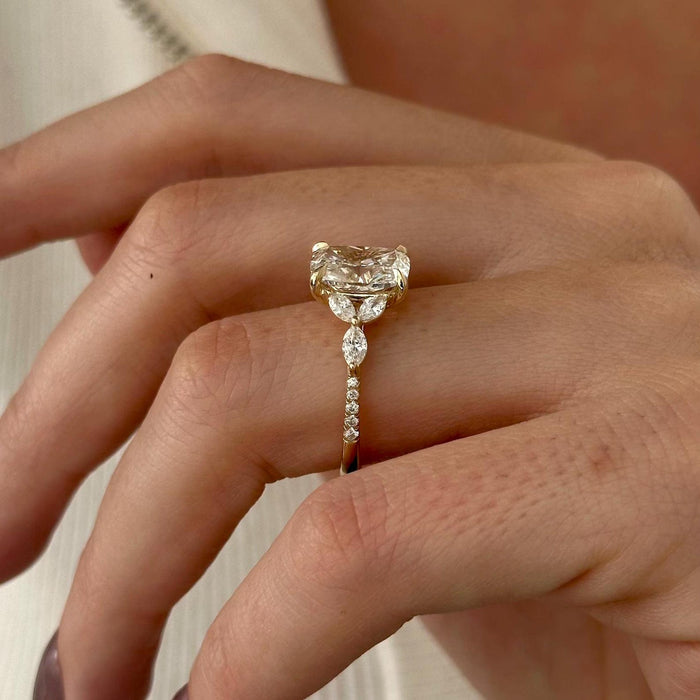 Elongated cushion moissanite marquise leaf cluster engagement ring in yellow gold, view 2