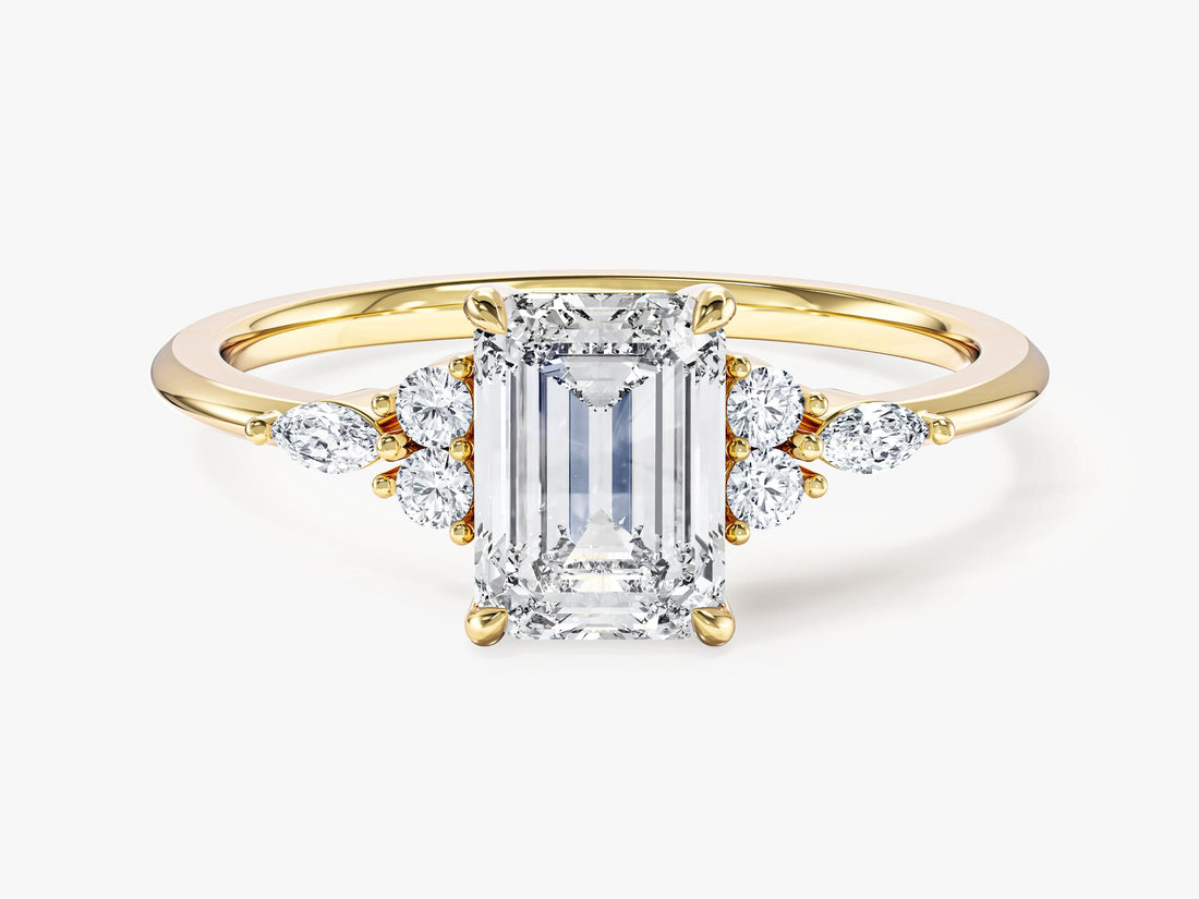 Emerald cut moissanite cluster engagement ring with marquise and round accents in 14K yellow gold, front view