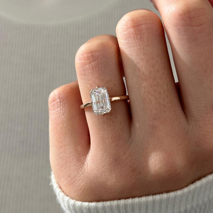Emerald cut moissanite solitaire engagement ring in rose gold, view 2