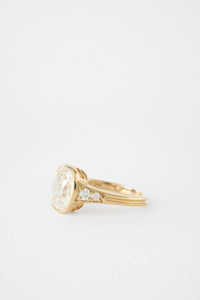 Antique elongated cushion moissanite bezel engagement ring with pave shoulders in yellow gold, view 2