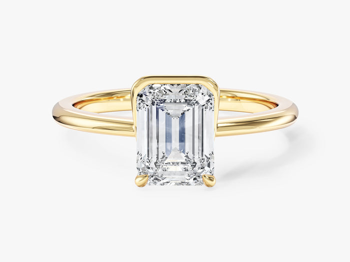 Emerald cut lab grown diamond half bezel and claw solitaire in yellow gold, front view